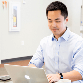 HealthVerity team member working on a laptop